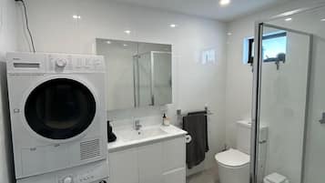 Shower, hair dryer, towels, soap