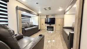 Living area - Beautiful Star Valley RV campground 5th wheel with pool, golf, & private gazebo (Thayne)