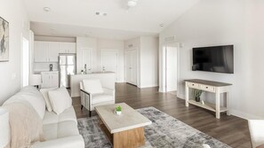Standard Apartment (2 Bedrooms) | Living area | 50-inch TV with digital channels - Landing Apartments Huntsville near Lake Forest (Huntsville)