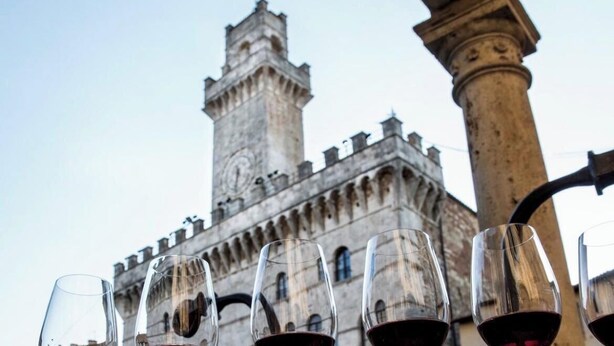 A historic building with a prominent tower and arched windows. - Dimora Petrucci luxury vacation rental in the heart of Montepulciano (Montepulciano)