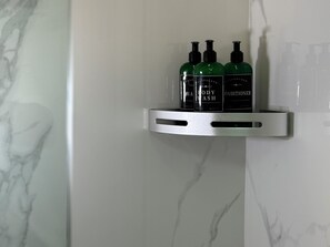 Shower, hair dryer, towels, soap