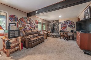 TV, fireplace, books - Bear Cabin: Walk to Lake! Porch views, updated, cozy, Rafting is open! Dog (Carnelian Bay)