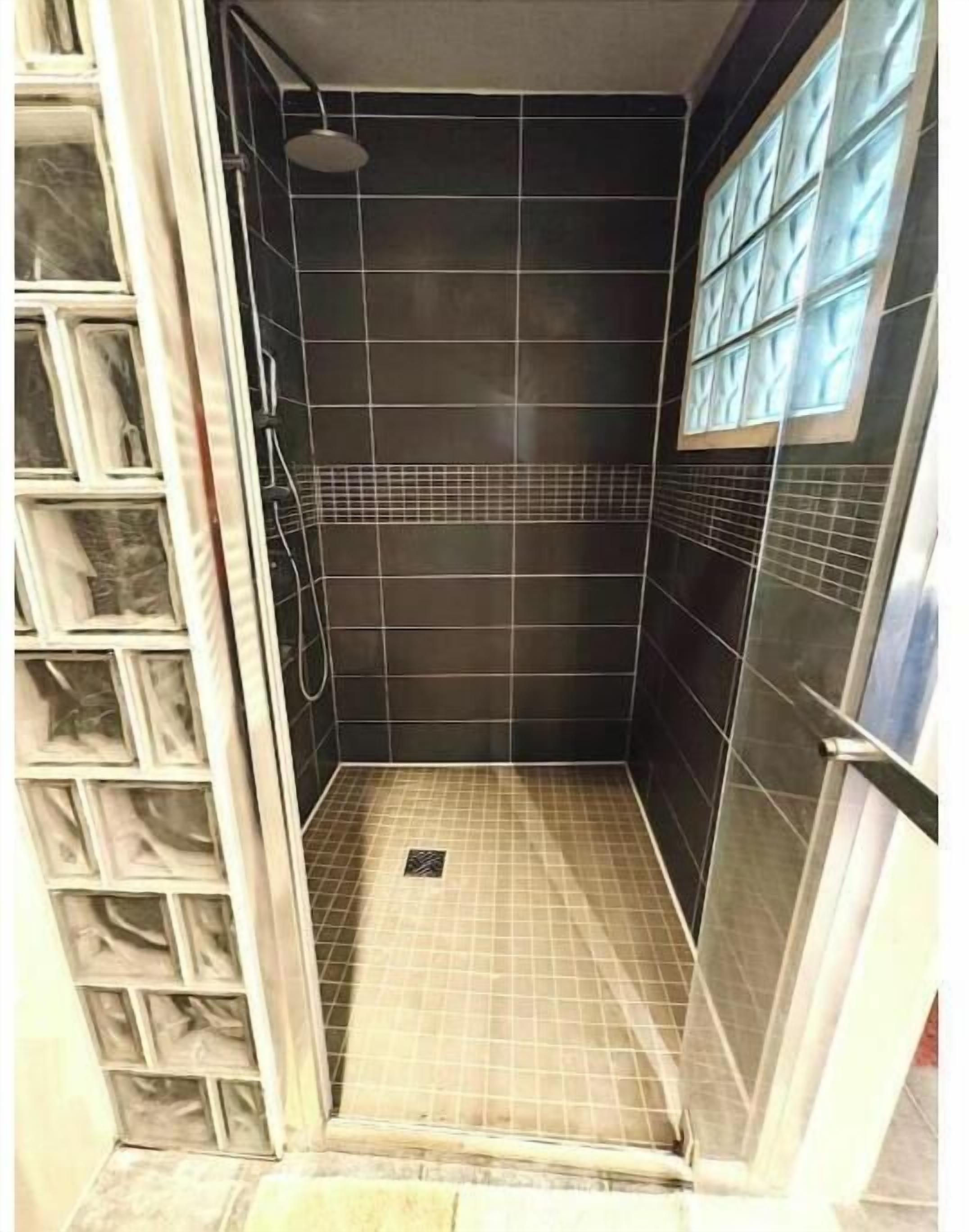 Shower, hair dryer, towels, toilet paper