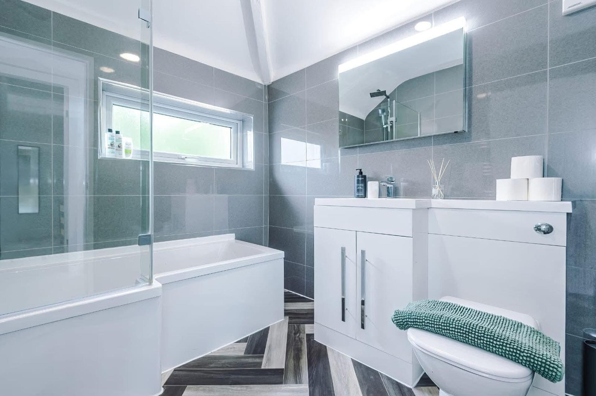 Combined shower/bathtub, deep-soaking bathtub, towels