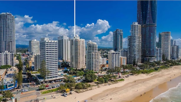 A coastal cityscape with high-rise buildings, a beach, and a clear sky. - Moroccan Surfers - 3BR Apartment (Surfers Paradise)