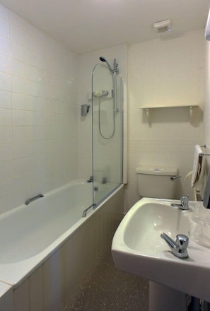 A bathroom with a glass-enclosed shower, a bathtub, a sink, and a toilet. - Spy Glass & Kettle Hotel (Bournemouth)