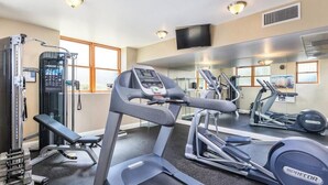 A gym with treadmills, a weight bench, and a squat rack. - Convenient Acessible Studio Condo for Comic Con 2026 San Diego (San Diego)