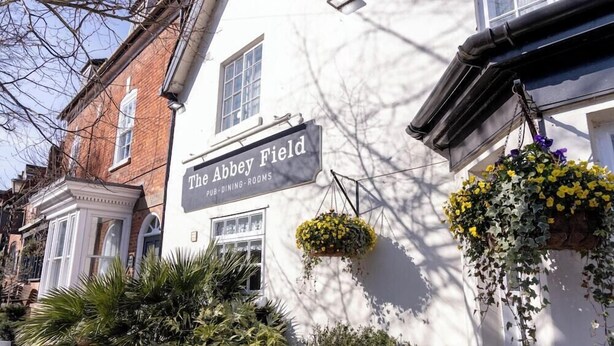 A building with a sign reading 'The Abbey Field Pub-Dining-Rooms.' - Milsoms Hotel (Kenilworth)