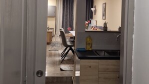 A modern kitchen with a countertop, sink, and cabinets. - The Famenne Escape (Marche-en-Famenne)