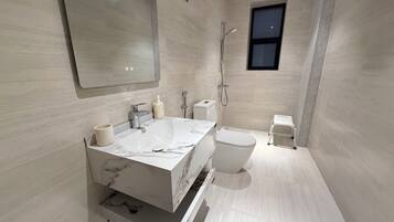 Shower, hair dryer, towels, soap