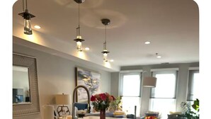 A modern kitchen with stainless steel appliances, pendant lighting, and a large window. -  Hoboken Grand House- 3 Bedroom 2.5 Bathroom with a private rooftop (Hoboken)