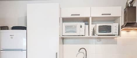 Fridge, microwave, cookware/dishes/utensils