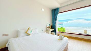 Quarto quádruplo, vista para a praia