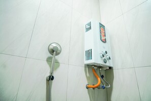Deluxe Double Room, City View | Bathroom | Shower, towels, soap - INSTAY Hotel Dieng Chill Serenity (Garung)