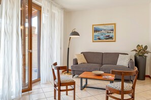 Living area - Apartment 'Katy Lake Rosmarino' with Private Terrace, Wi-Fi, and Air Conditioning (Peschiera del Garda)