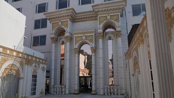 A building with classical architecture, featuring columns and arches.