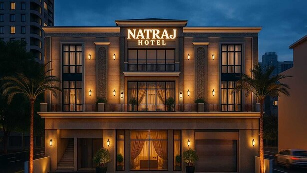 A hotel with a prominent sign, a balcony, and a well-lit entrance. - HOTEL NATRAJ (Sirsa)