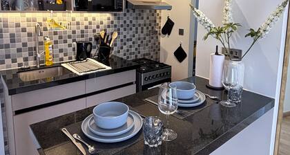 Cozy 1-bedroom apt in welcoming Tatu City with fitness room, pool, green space