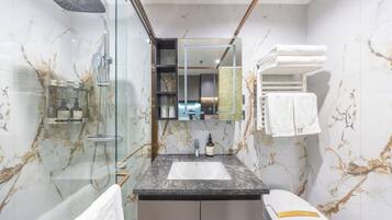Basic Twin Room | Bathroom | Shower, hair dryer, slippers, towels