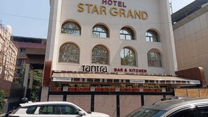 A hotel named Star Grand with a bar and kitchen on the ground floor. - Mosaic Go Star Grand (Navi Mumbai)