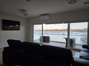 Living area - Waterfront condo with pool, beach 1 minute walk, in Lans Euxpines (Lance aux Epines)