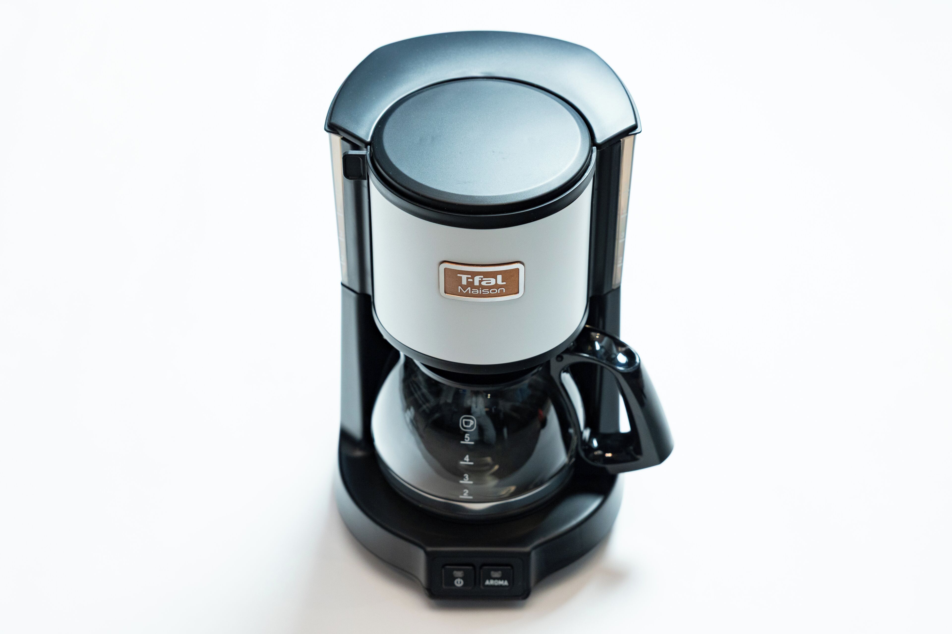 A Tefal coffee maker with a digital display and aroma button.