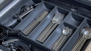 A drawer with compartments containing various utensils and keys. - Standard Studio 6 at The Orange Door Little Venice (Greater London)
