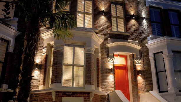 A multi-story building with a brick facade, large windows, and a prominent red door. - Premium Studio 14 at The Orange Door Little Venice (Greater London)