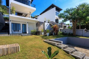 A modern two-story house with a balcony, a small pool, and a staircase leading to the upper floor. - ediResidences Family Pool Villa w/ Ocean View (Koh Samui)