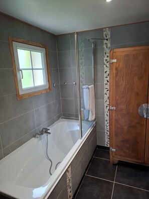 Shower, hair dryer, towels, toilet paper