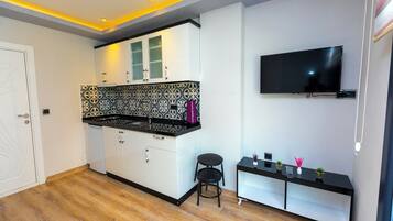 Suite clásica, balcón, vistas al río | Cocina privada