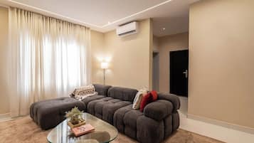 Appartement Économique, balcon, vue ville | Coin séjour