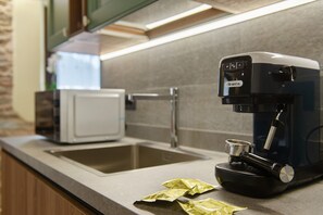 Fridge, microwave, stovetop, coffee/tea maker