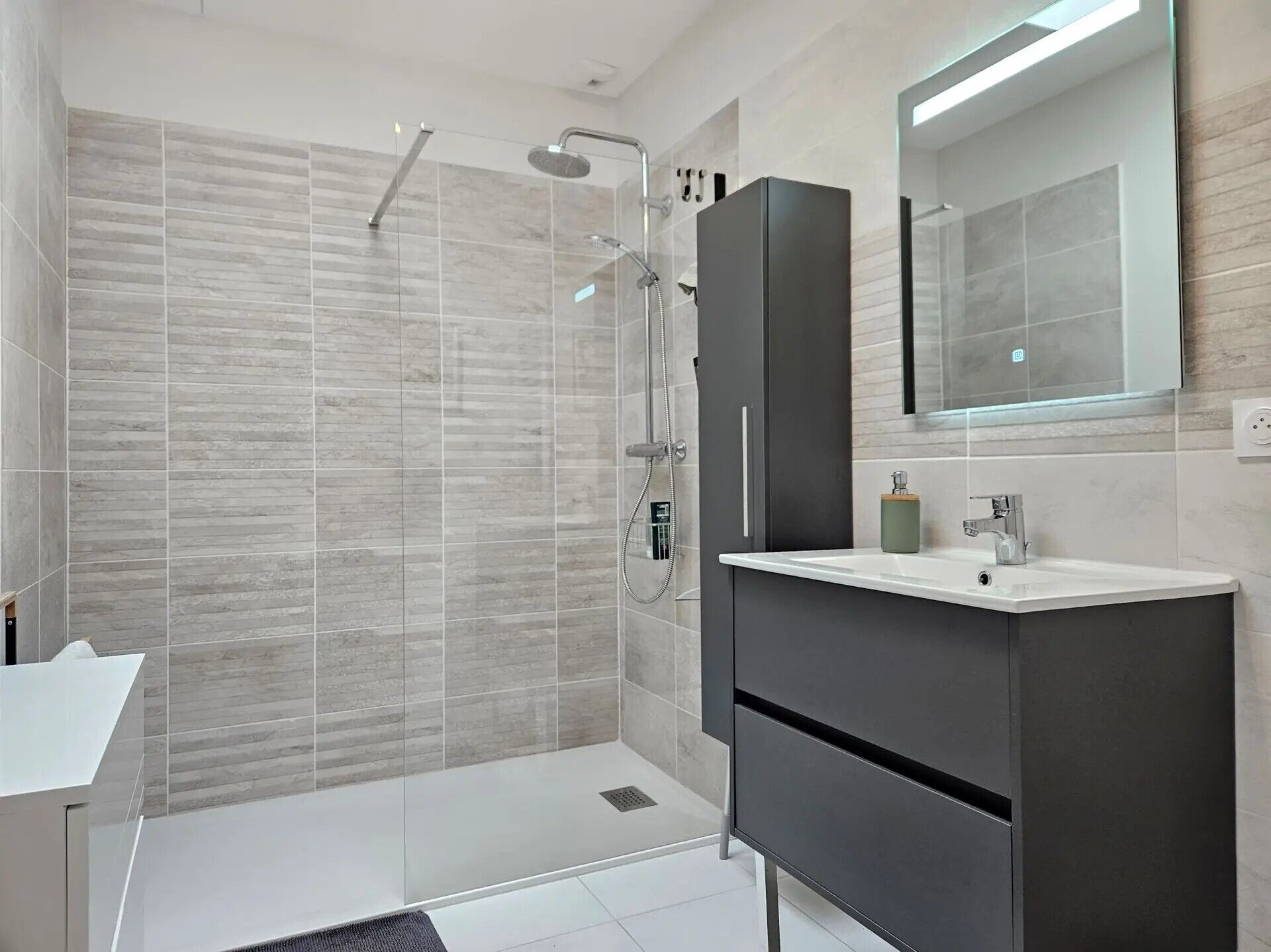 Shower, hair dryer, towels, toilet paper
