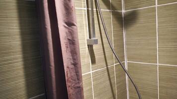 Shower, hair dryer, towels, toilet paper