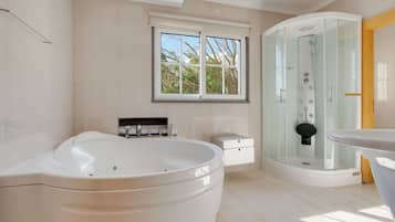 Family Villa, Garden View | Bathroom | Hair dryer, towels, soap, shampoo