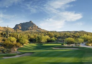 A desert landscape with a golf course, cacti, and a mountain in the background. - Fountain Hills Gem >Pool, Balcony & Mountain View (Fountain Hills)