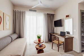 Family Suite, Sea View | Living area | 42-inch Smart TV with digital channels - Armia Experience Hotel (Syros)