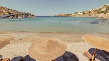 On the beach, sun-loungers, beach umbrellas, beach towels