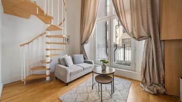 Deluxe Apartment, Balcony | Living area | Flat-screen TV