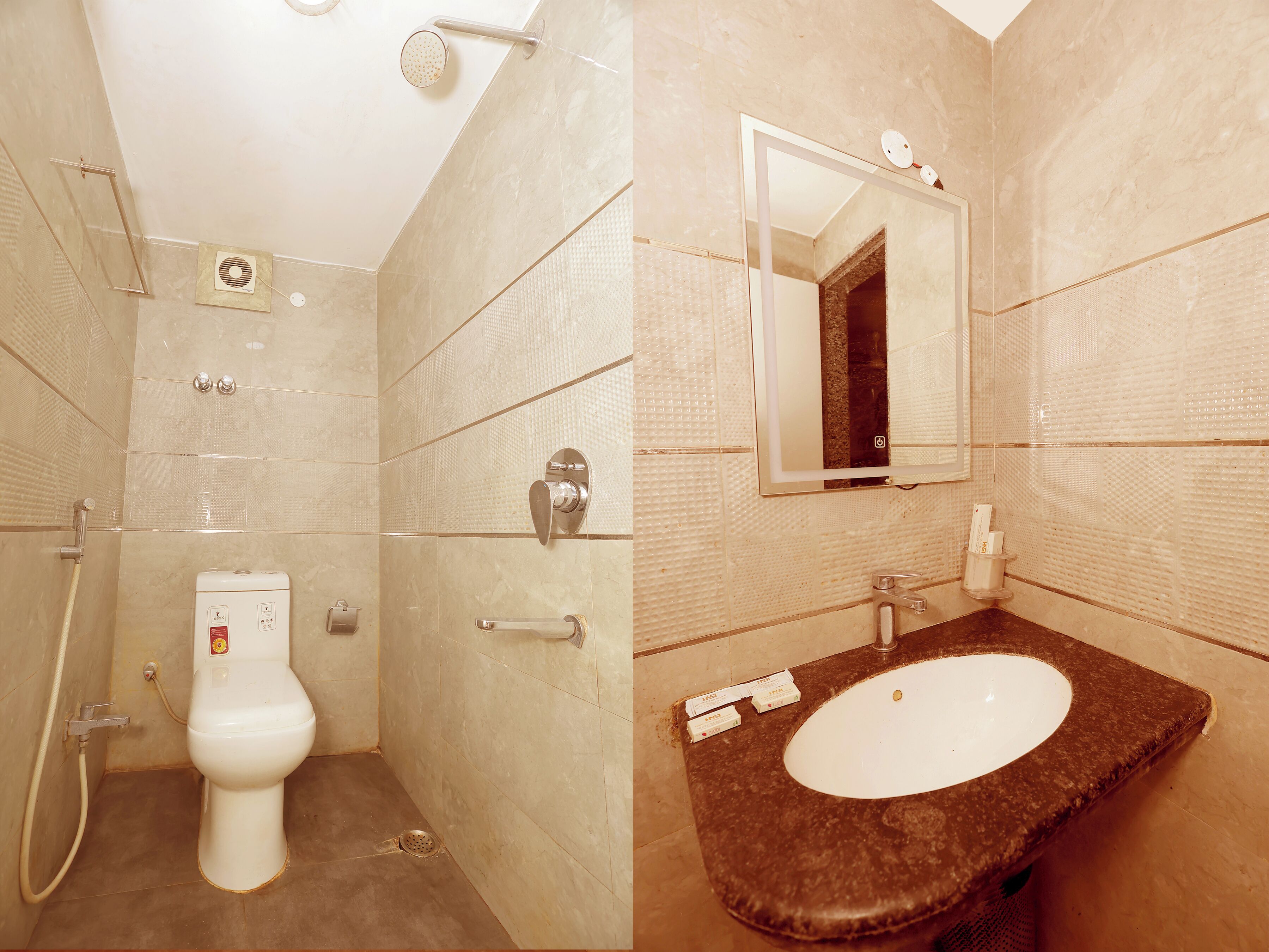 A bathroom with a toilet, shower, and sink.