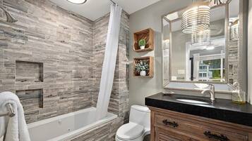 Shower, jetted bath, hair dryer, towels