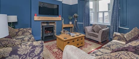 Smart TV, fireplace, books