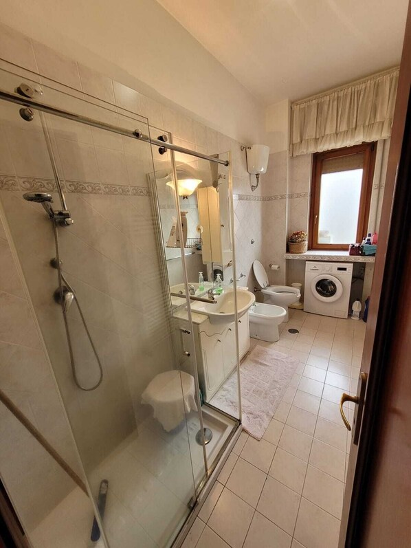 Shower, bidet, towels, soap