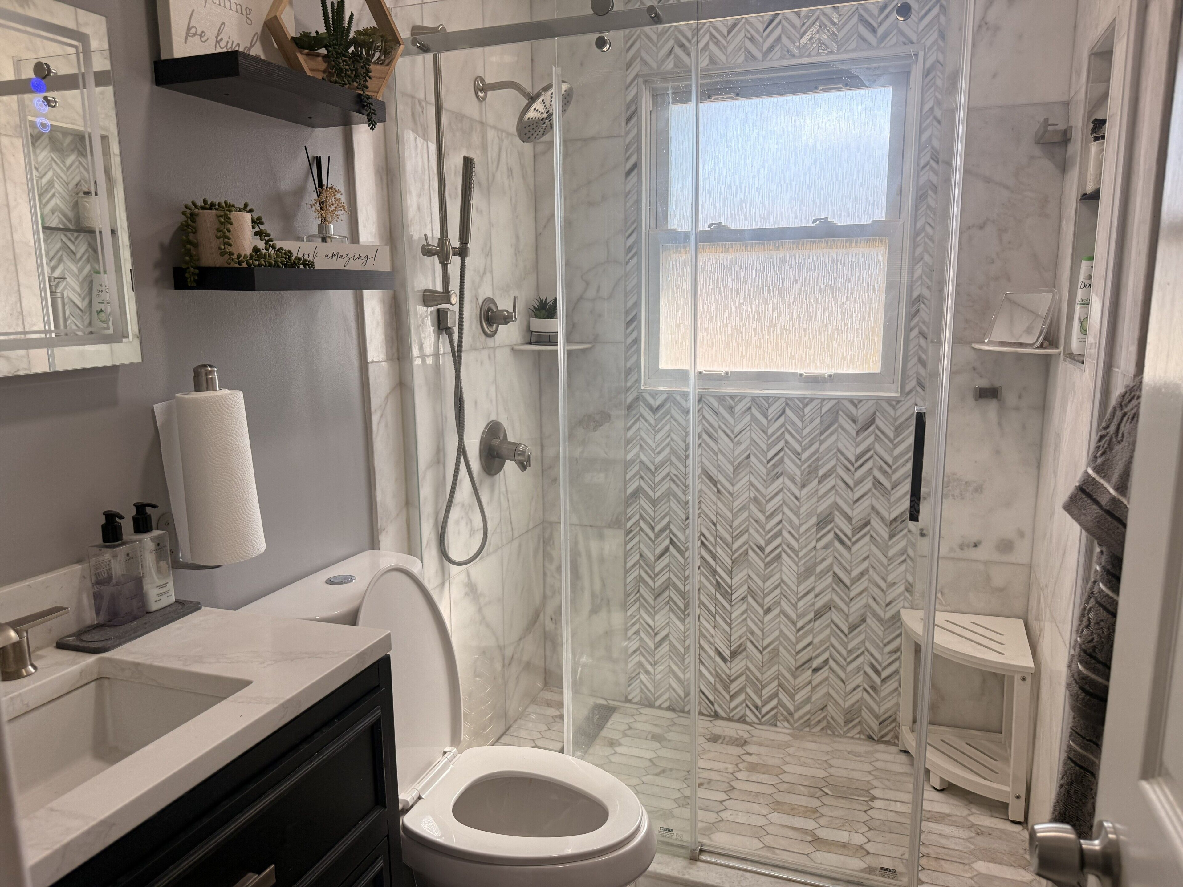 Shower, towels, soap, toilet paper