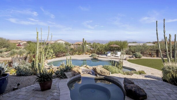 A hot tub surrounded by a landscaped garden with cacti and a pool. - Ranch Road Desert Oasis...Privacy...Unbelievable Mountain Views! (Scottsdale)