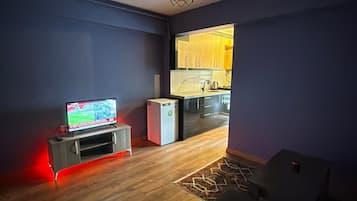 Comfort Condo, 1 Double Bed with Sofa bed, Smoking, Balcony | Living area | 42-inch Smart TV with satellite channels