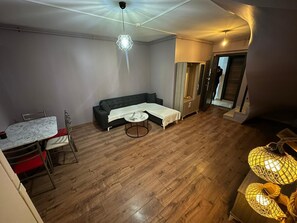 Deluxe Apartment, 2 Bedrooms | Living area | 42-inch Smart TV with satellite channels