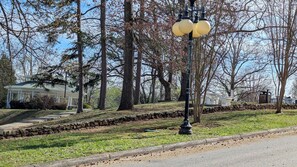 A park with a gazebo, stone wall, and lamp post. - Furnished Rental near Oakridge in Historic Downtown Harriman (Harriman)