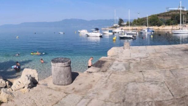 A coastal marina with boats, clear water, and a stone walkway. - Comfort Kostrena Apartments Rijeka (Kostrena)